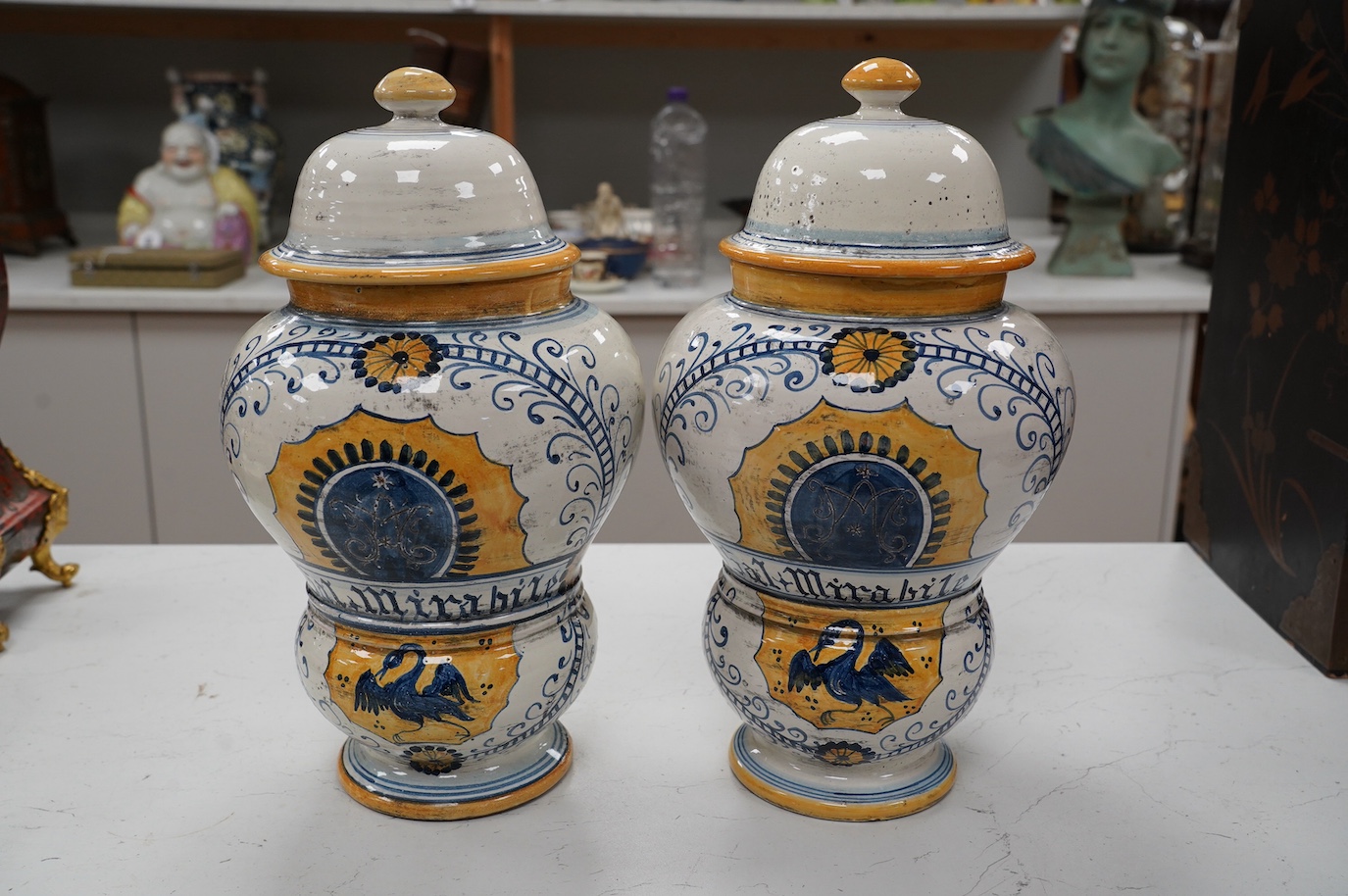 A pair of 17th century style maiolica drug jars and covers, 34cm. Condition - good